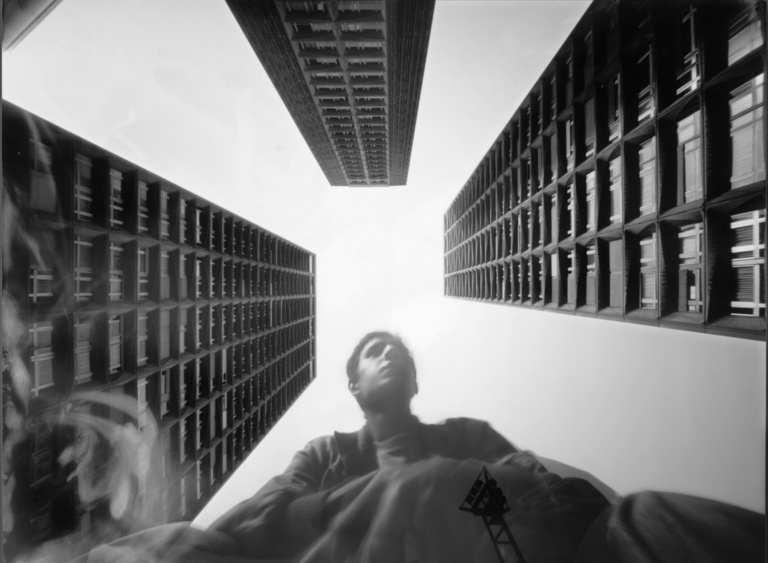 François Vogel - selfportrait below housing towers